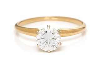 A 14 Karat Yellow Gold and Diamond Solitaire Ring, 1.30 dwts.
