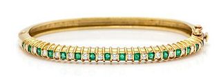 An 18 Karat Yellow Gold, Emerald, and Diamond Bangle Bracelet, J. Cooper, 14.20 dwts.
