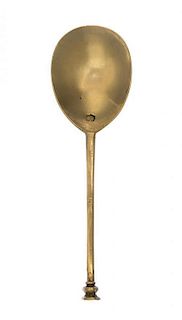 A Provincial James I or Charles I Silver-Gilt Seal Top Spoon, Early 17th Century, with fluted baluster handle and plain circular