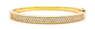 An 18 Karat Yellow Gold and Diamond Bangle Bracelet, 18.50 dwts.