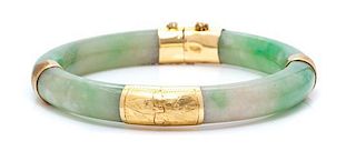 A Yellow Gold and Jade Bangle Bracelet, 29.20 dwts.