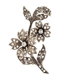* A Silver Topped Gold and Diamond Flower Brooch, 8.70 dwts.