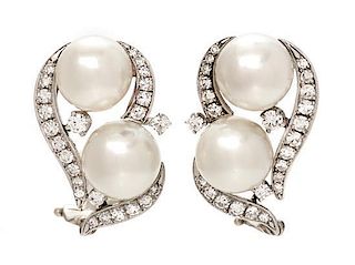 A Pair of 18 Karat White Gold, Cultured Pearl and Diamond Earclips, 6.90 dwts.