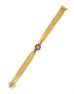 * An 18 Karat Yellow Gold and Ruby Bracelet, 14.20 dwts.