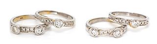 A Collection of 18 Karat White Gold and Diamond Stacking Rings, 10.50 dwts.