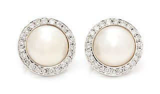 * A Pair of White Gold, Cultured Mabe Pearl and Diamond Earclips, 10.30 dwts.
