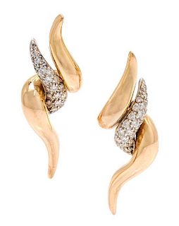 * A Pair of 18 Karat Bicolor Gold and Diamond Earclips, 7.10 dwts.
