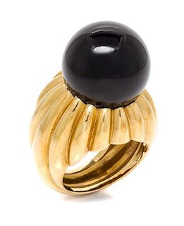 * An 18 Karat Yellow Gold and Onyx Ring, C. Vollrath, 15.30 dwts.