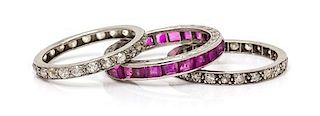 A Collection of Platinum, Diamond and Pink Sapphire Eternity Bands, 4.80 dwts.
