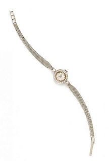 An 14 Karat White Gold and Diamond Wristwatch, Cellini, Circa 1958, 10.70 dwts