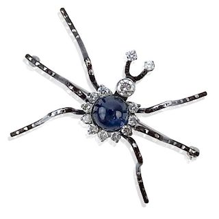 Contemporary Round Brilliant Cut Diamond, Large Star Sapphire and 14 Karat White Gold Spider Brooch.