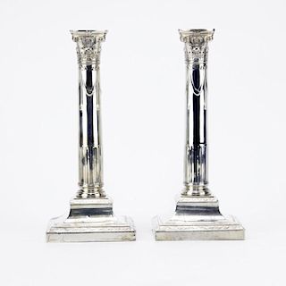 Pair of Weighted Sterling Silver Candlesticks.