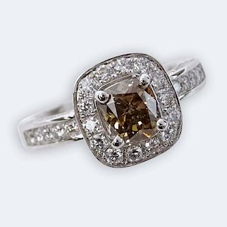 AIG Certified 1.13 Carat Cushion Cut Fancy Brown Diamond and Platinum Ring accented throughout with 1.44 Carat Round Brilliant Cut Diamonds.