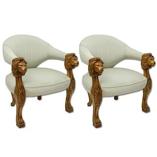 Pair of Italian Style Carved Wood and Upholstered Arm Chairs. Both are decorated with lion head and claw feet motif.