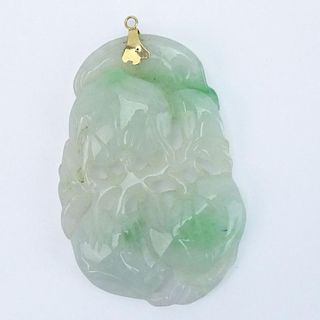Chinese Open Carved Celadon Jade Pendant with 14 Karat Yellow Gold Mount.