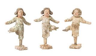 A Set of Three Painted Pottery Figures of Dancers Height of tallest 9 1/4 inches. 彩繪陶跳舞俑一組三件，唐，最高9.25英吋
