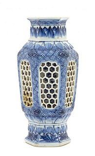 A Chinese Blue and White Porcelain Hexagonal Vase Height 8 3/4 inches. 青花鏤雕六邊形瓶，18世纪，高8.75英吋