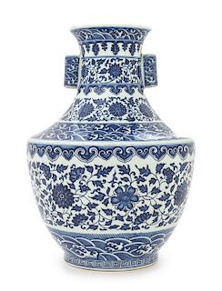 A Blue and White Porcelain Vase Height 12 3/4 inches. 青花纏枝花卉紋貫耳瓶，高12.75英吋