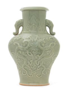 A Longquan Celadon Glazed Porcelain Vase Height 11 inches. 龍泉青釉龍紋象耳瓶，高11英吋