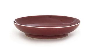 A Copper Red Glazed Porcelain Dish Diameter 6 1/2 inches. 紅釉盘，清乾隆，直徑6.5英吋