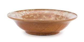 A Large Swatow Slip Decorated Brown Glazed Porcelain Charger Diameter 16 inches. 漳州窯棕釉佛獅游龍花卉紋大盤，明16世紀後半葉，