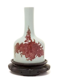 A Copper Red Decorated Porcelain Mallet-Form Vase Height of vase 7 3/8 inches. 白地紅釉鳳紋搖鈴尊，高7.375英吋