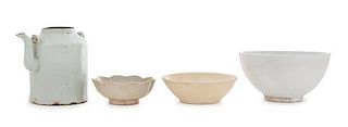 Four White Glazed Porcelain Articles Height of ewer 5 3/4 inches. 白釉瓷器四件，宋及明代，其中壶高5.75英吋