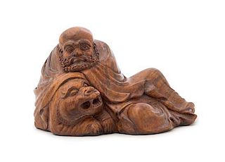 A Carved Wood Figural Group Length 5 inches. 木雕伏虎羅漢，長5英吋