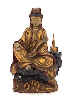 A Gilt Wood Figure of a Seated Guanyin Height 10 3/4 inches. 金彩木雕观音坐像，高10.75英吋