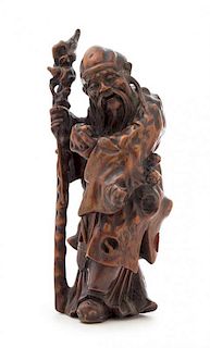 A Carved Wood Figure of Shoulao Height 10 1/2 inches. 硬木雕壽老立像，高10.5英吋