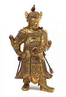 * A Gilt and Red Lacquered Wood Figure of Immortal Weituo Height 27 inches. 金漆木雕韋陀造像，高27英吋