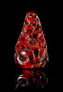 * A Carved Amber Toggle Height 2 inches. 琥珀雕件，高2英吋