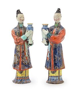 A Pair of Chinese Export Polychrome Enameled Porcelain Figures of Court Ladies Height of each 10 inches. 中國外銷瓷粉彩仕女立像一對，清
