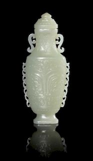 A Celadon Jade Vase Height 5 1/2 inches. 青白玉饕餮紋瓶，高5.5英吋