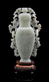 * A Celadon Jade Vase and Cover Height of jade 7 7/8 inches. 青白玉饕餮紋瓶，高7.875英吋