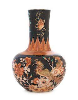 A Famile Noire Porcelain Bottle Vase Height 8 inches. 黑地紅彩鳳棲牡丹瓶，高8英吋