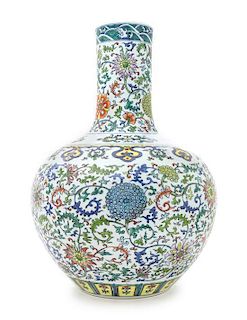 A Doucai Porcelain Bottle Vase Height 21 inches. 鬥彩纏枝花卉紋天球瓶，高21英吋