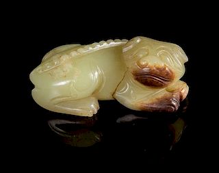 A Yellow Jade Figure of a Recumbent Dog Length 2 1/2 inches. 黄玉雕卧狗，長2.5英吋