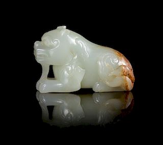 A Celadon Jade Toggle of a Beast Length 2 1/2 inches. 青玉雕瑞獸擺件，長2.5英吋