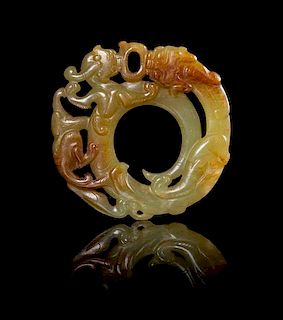 A Celadon and Russet Jade Plaque Diameter 2 1/8 inches. 青黃玉螭龍珮，直徑2.125英吋