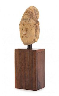 * A Stone Head of Guanyin Height 3 1/2 inches. 石雕觀音頭像，高3.5英吋