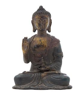 A Bronze Figure of a Buddha Height 6 1/4 inches. 铜佛坐像，高6.25英吋