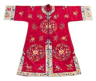 * A Chinese Embroidered Silk Lady's Robe Length 40 1/2 inches. 紅地緞繡花卉紋女袍，高40.5英吋