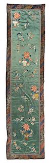 A Chinese Embroidered Silk Rectangular Panel Height 74 1/4 x width 19 1/2 inches. 綠地緞繡花卉紋面料一塊，高74.25x寬19.5英吋