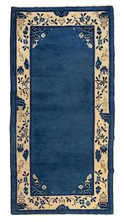 A Chinese Wool Rug Length 2 feet 11 1/2 inches x width 5 feet 9 3/4 inches.