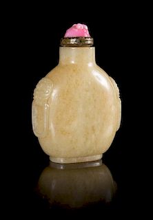 A Mottled Yellow Jade Snuff Bottle Height 3 1/8 inches. 黄玉鋪首耳鼻煙壺，高3.125英吋