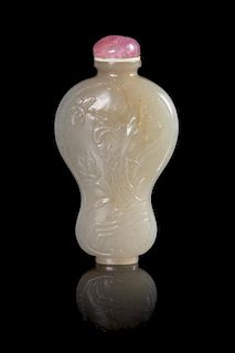 A Pale Celadon Jade Snuff Bottle Height 2 1/2 inches. 青白玉蝴蝶花卉紋葫蘆形鼻煙壺，高2.25英吋