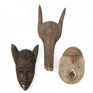 Two West African Carved Wooden Masks and a Headdress