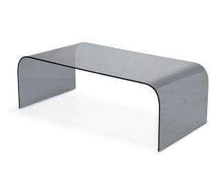 A contemporary glass waterfall coffee table