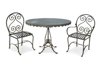 A black iron bistro table and chairs